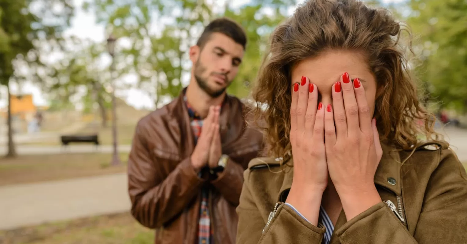 Individual reflecting on the distinction between sincere and toxic apologies in relationships