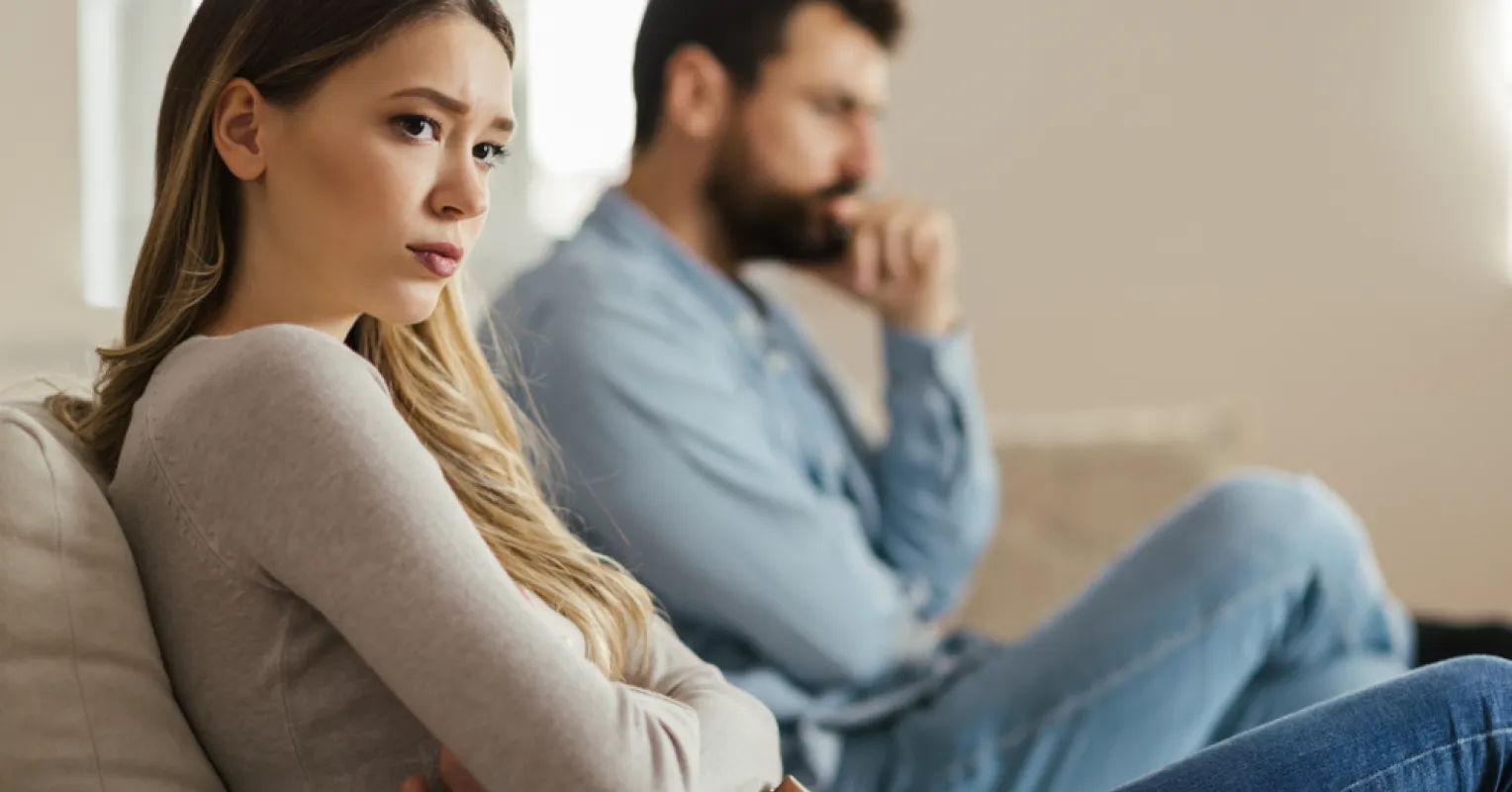 Person reflecting on uncertainty in a relationship connected to why do some people become distant when things get
