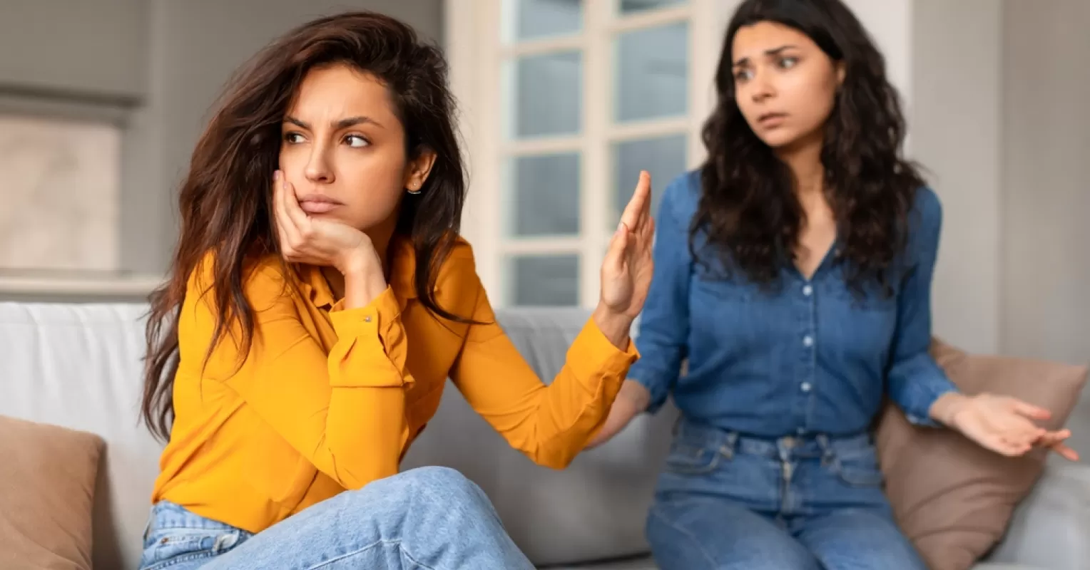 Twins sharing a candid moment, reflecting rivalry and jealousy in their relationship