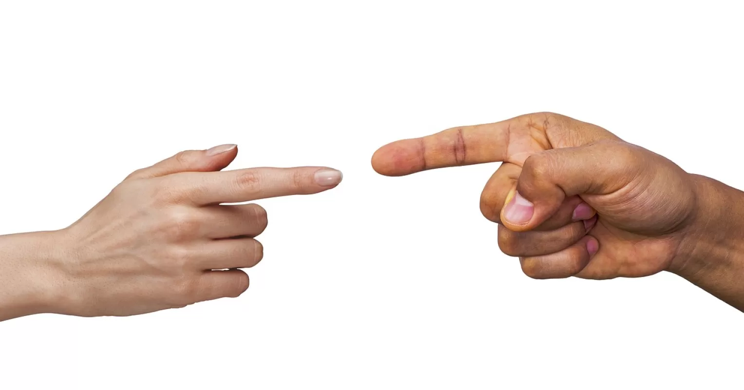 Couple discussing their differing opinions during a tense argument about compromise