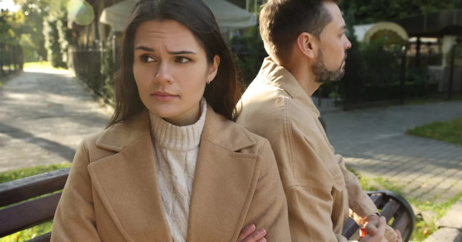 Couple in a heartfelt conversation, discussing relationship status and commitment signals