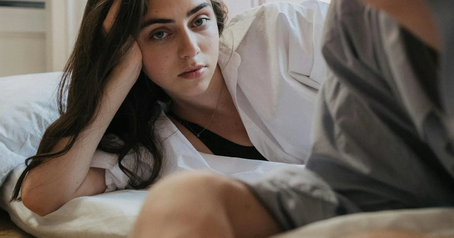Person feeling isolated while sharing negative experiences with an uninterested partner