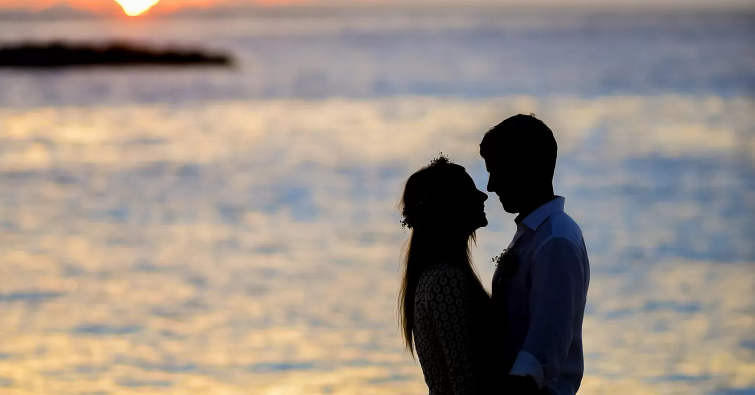 A couple discusses love while one partner shows signs of disrespectful behavior.
