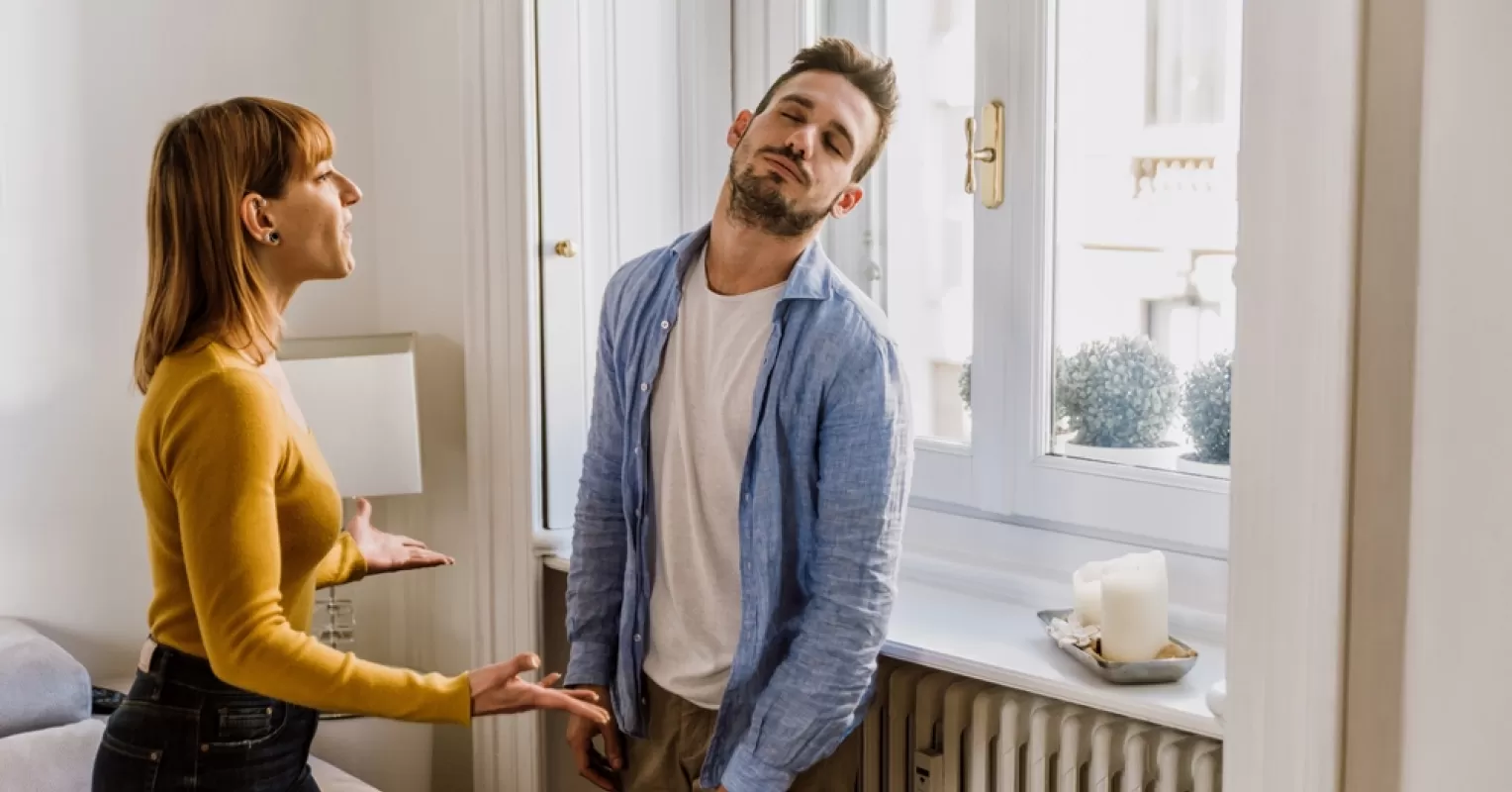 Couple struggling to connect emotionally during intimate conversation at a café