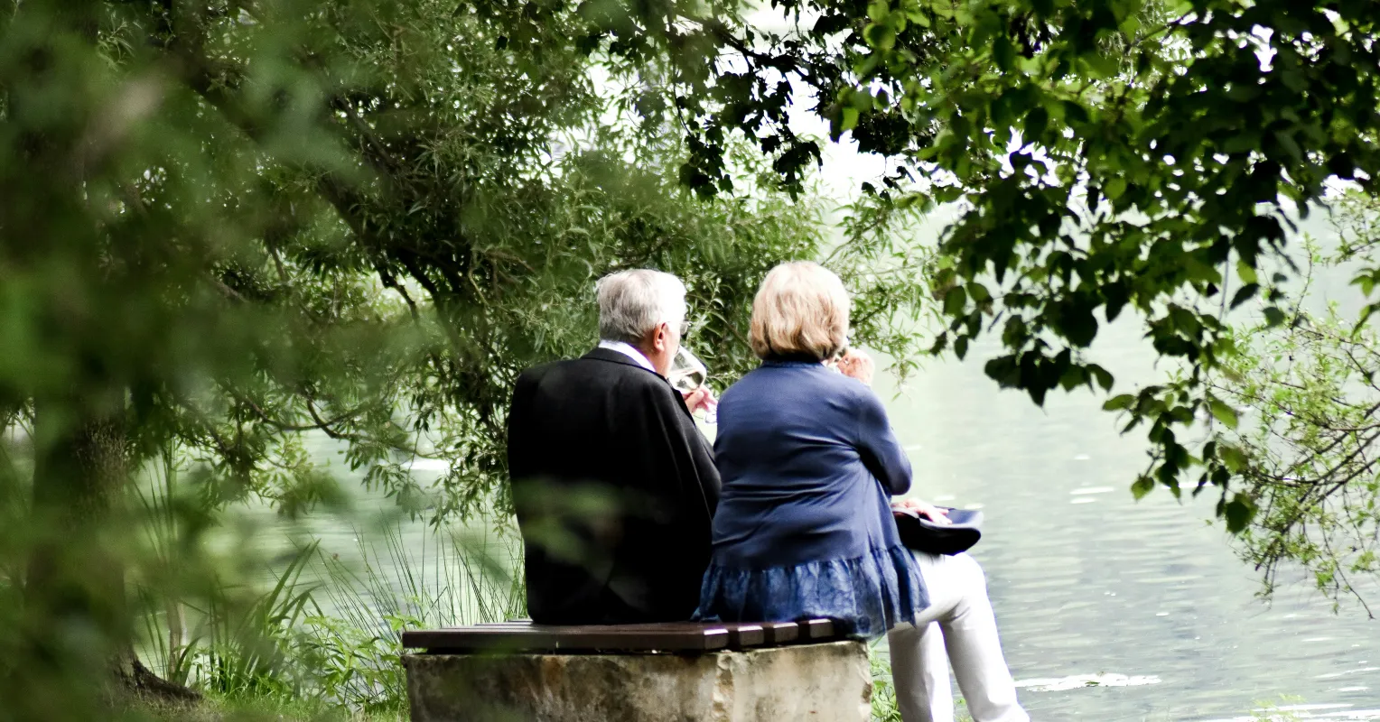 Two people discussing feelings about their late-in-life divorce, revealing complex emotional signals.