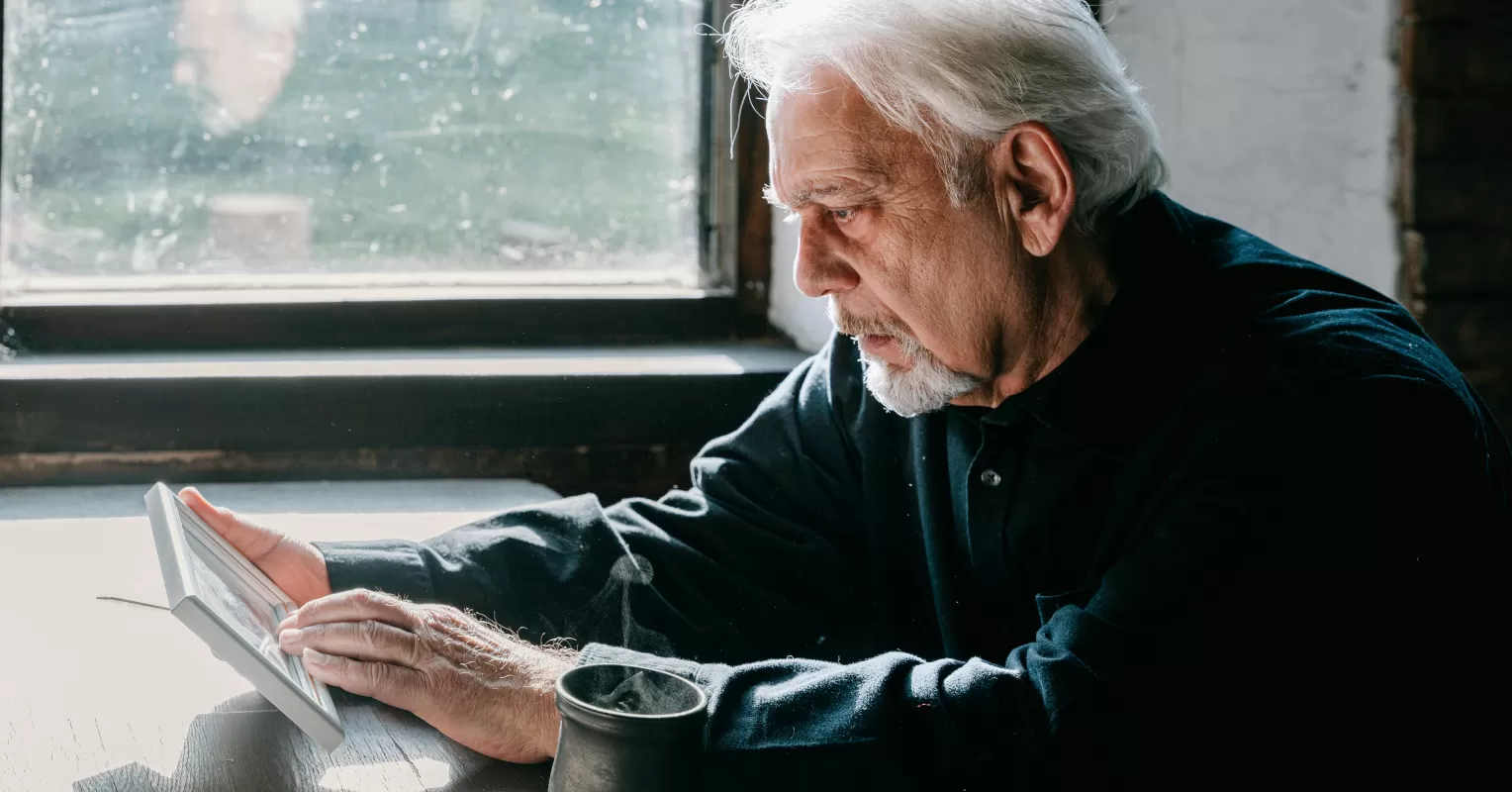 Individual contemplating the emotional challenges of reaching out to estranged family members