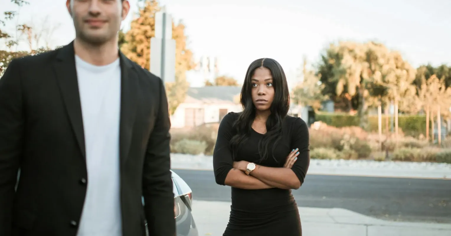 Couple discussing unresolved conflicts, exploring why past issues worsen their relationship