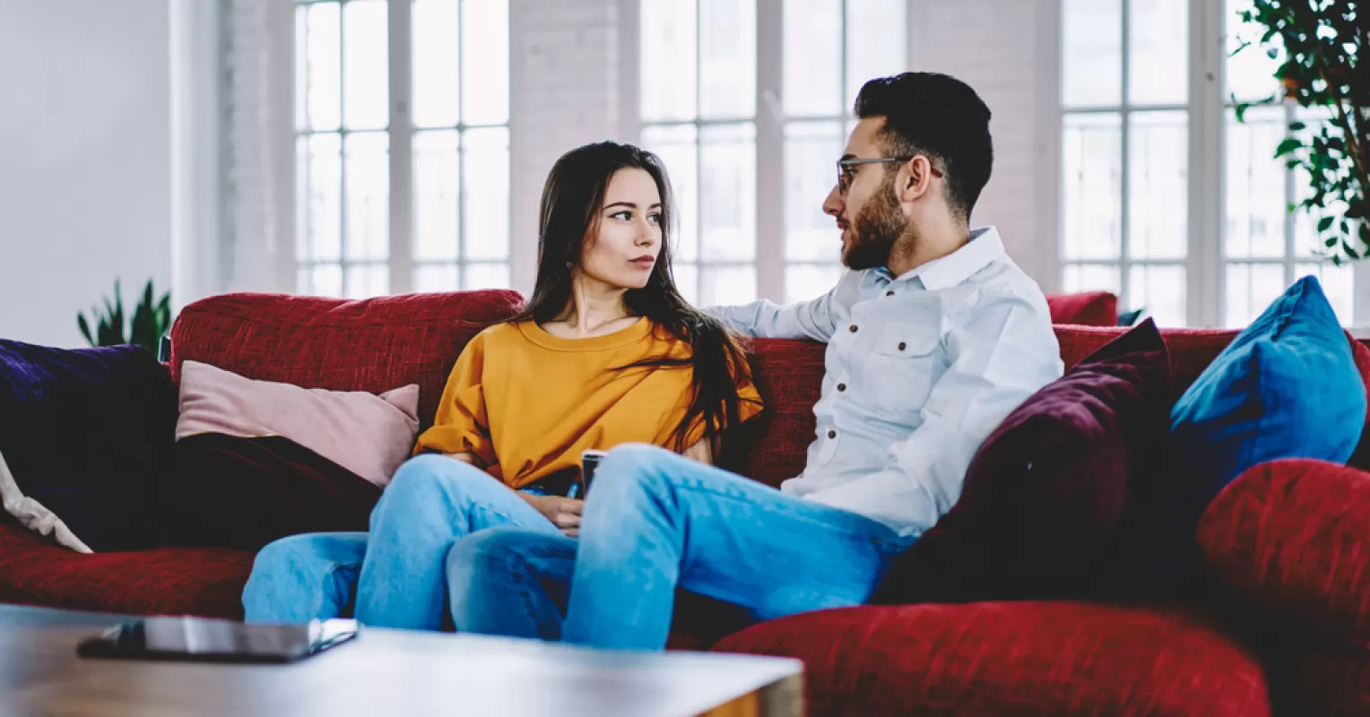 Couple engaging in storytelling to rebuild trust and strengthen their relationship.