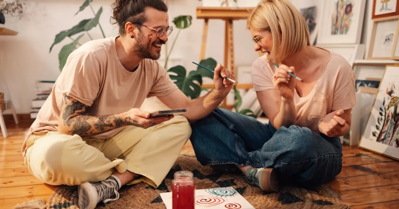Couple enjoying a heartfelt conversation during a relaxing picnic, emphasizing quality time in relationships
