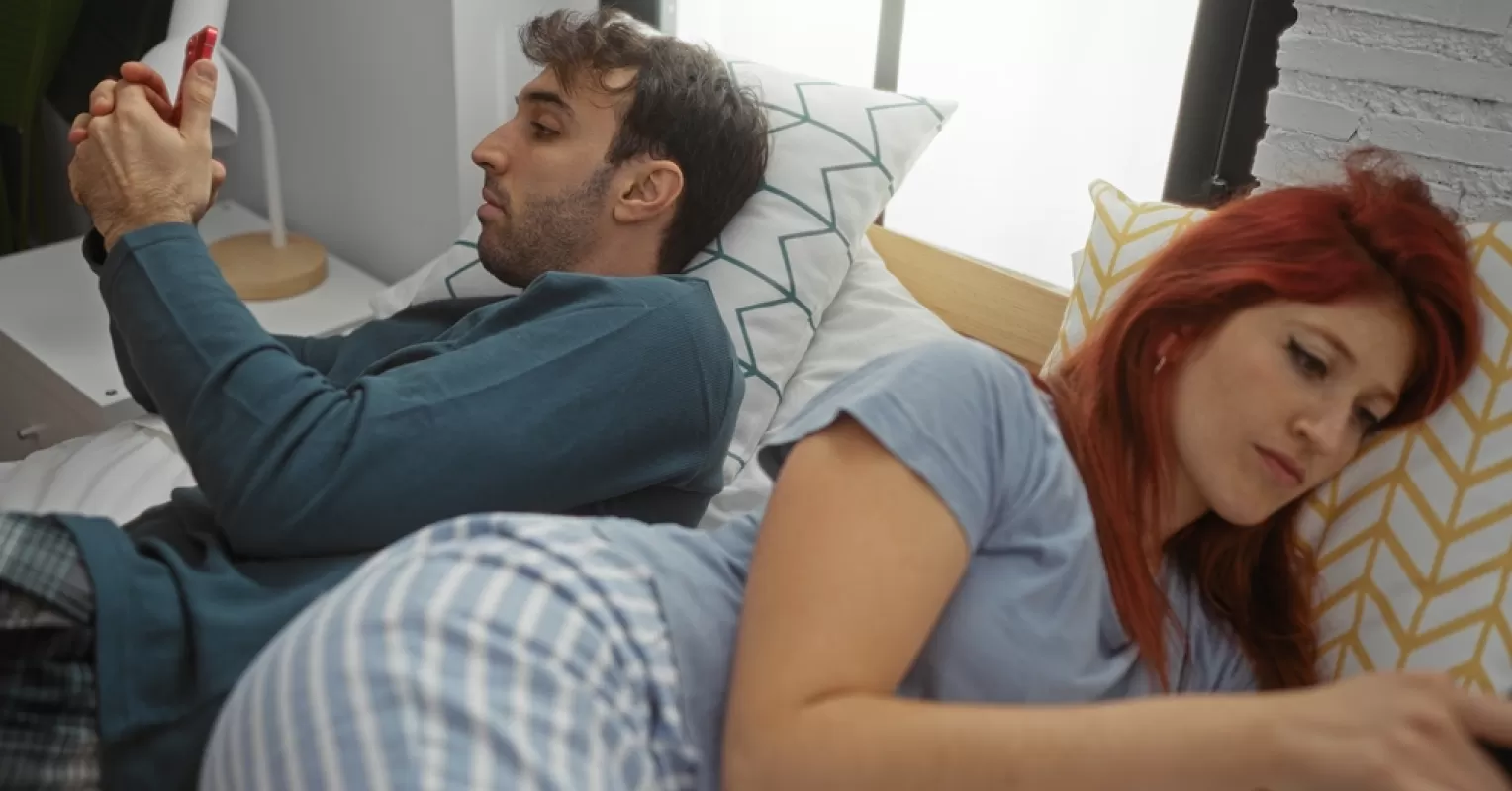 Individual contemplating mixed emotions from their online relationship dynamics