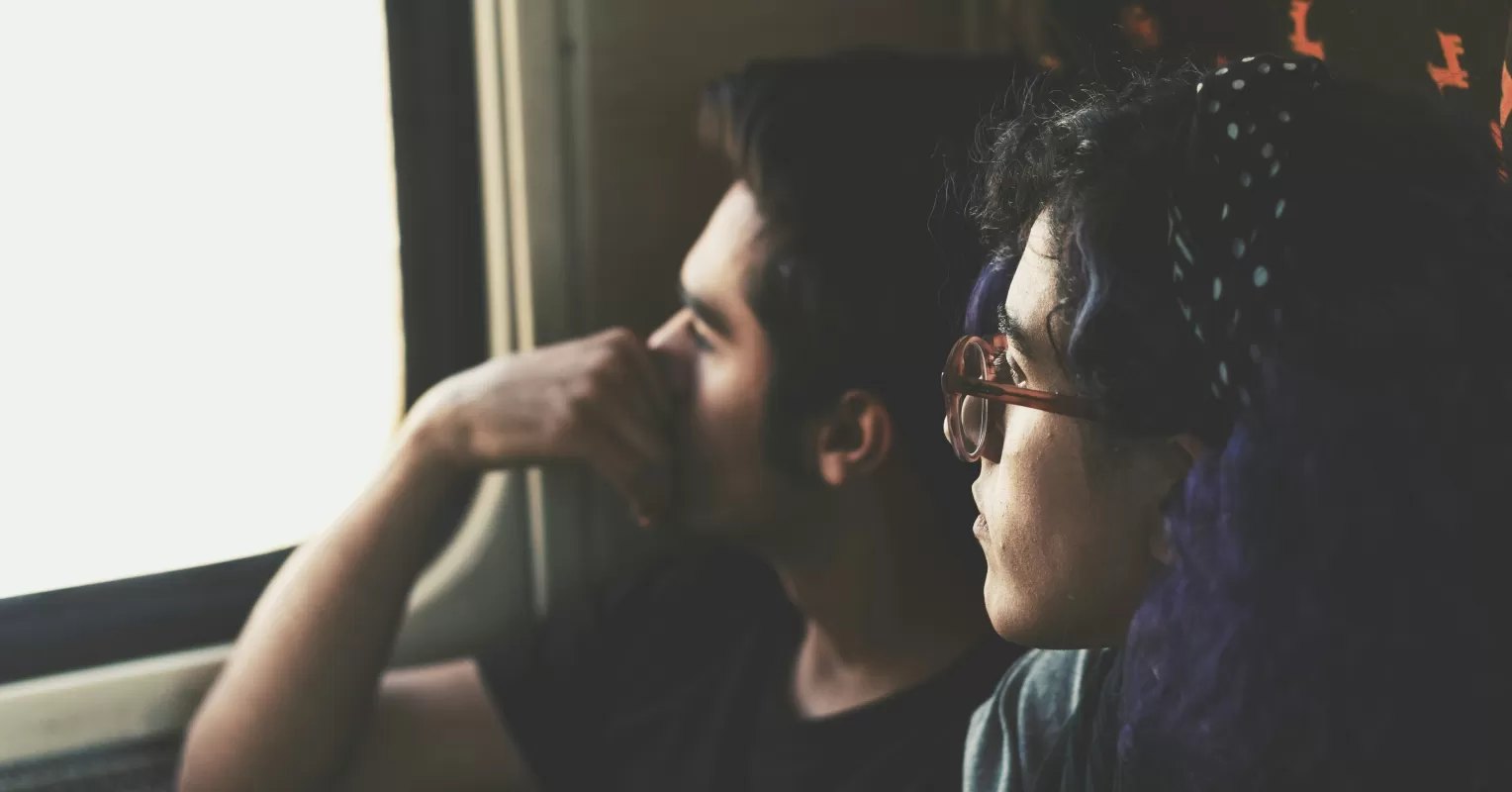 A couple discussing feelings while handling each other's stress in a cozy setting