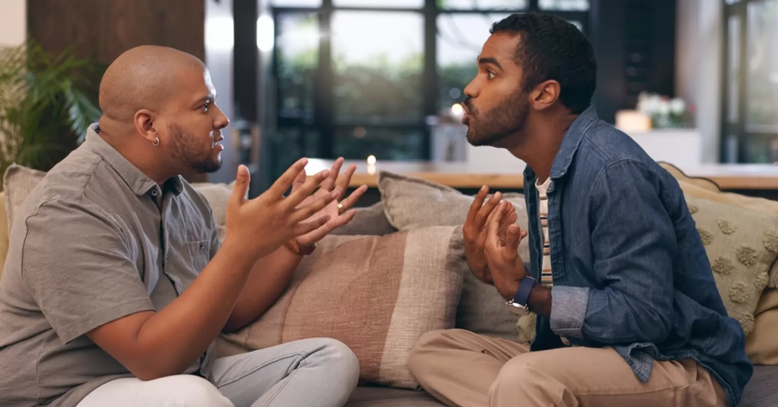 Individual contemplating emotions and withdrawal after a disagreement in a relationship