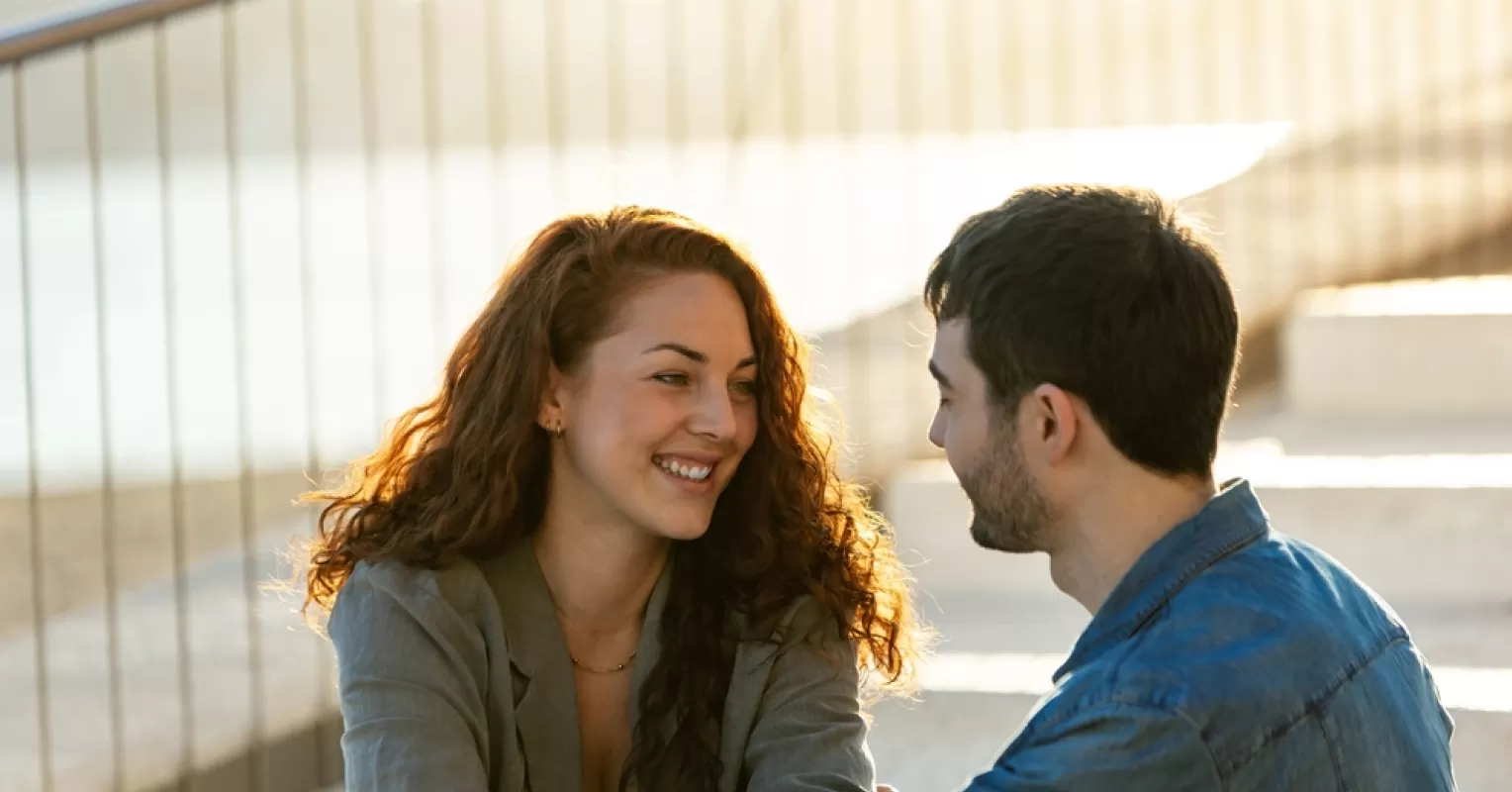 Couple enjoying a moment together, yet one partner seems distant emotionally