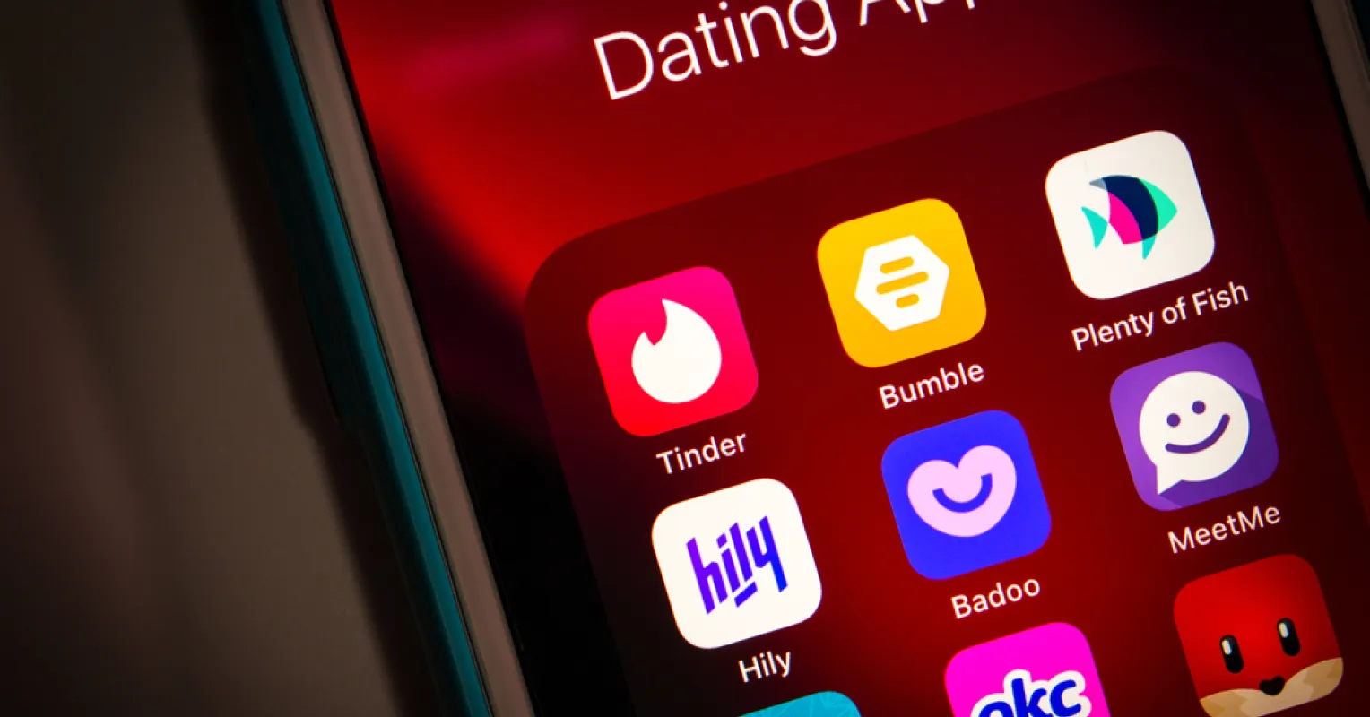 A person contemplating their feelings about dating apps and relationship signals.