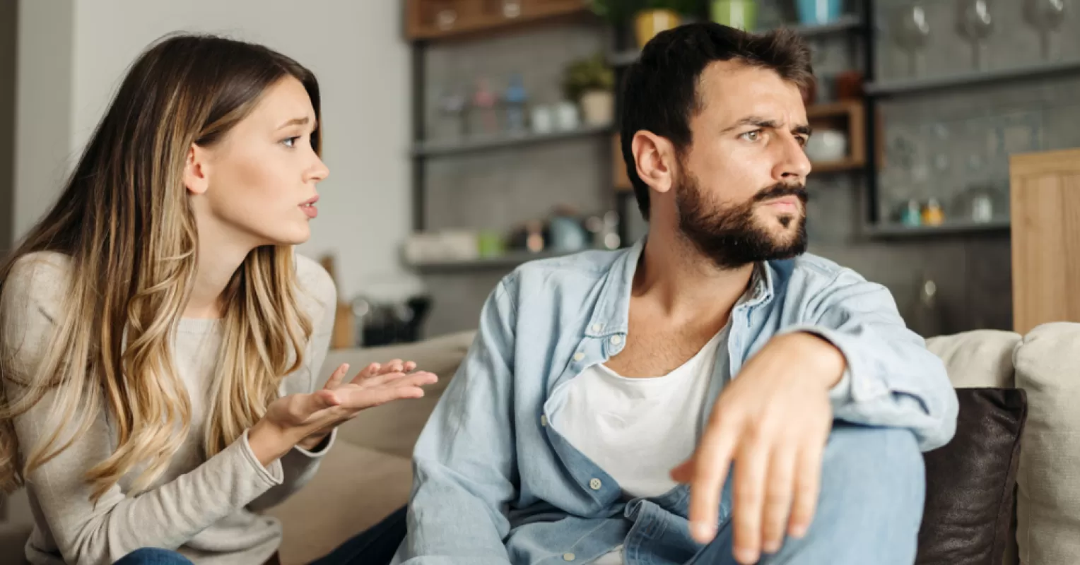 Individual contemplating their attraction to emotionally unavailable partners while observing relationship signals.