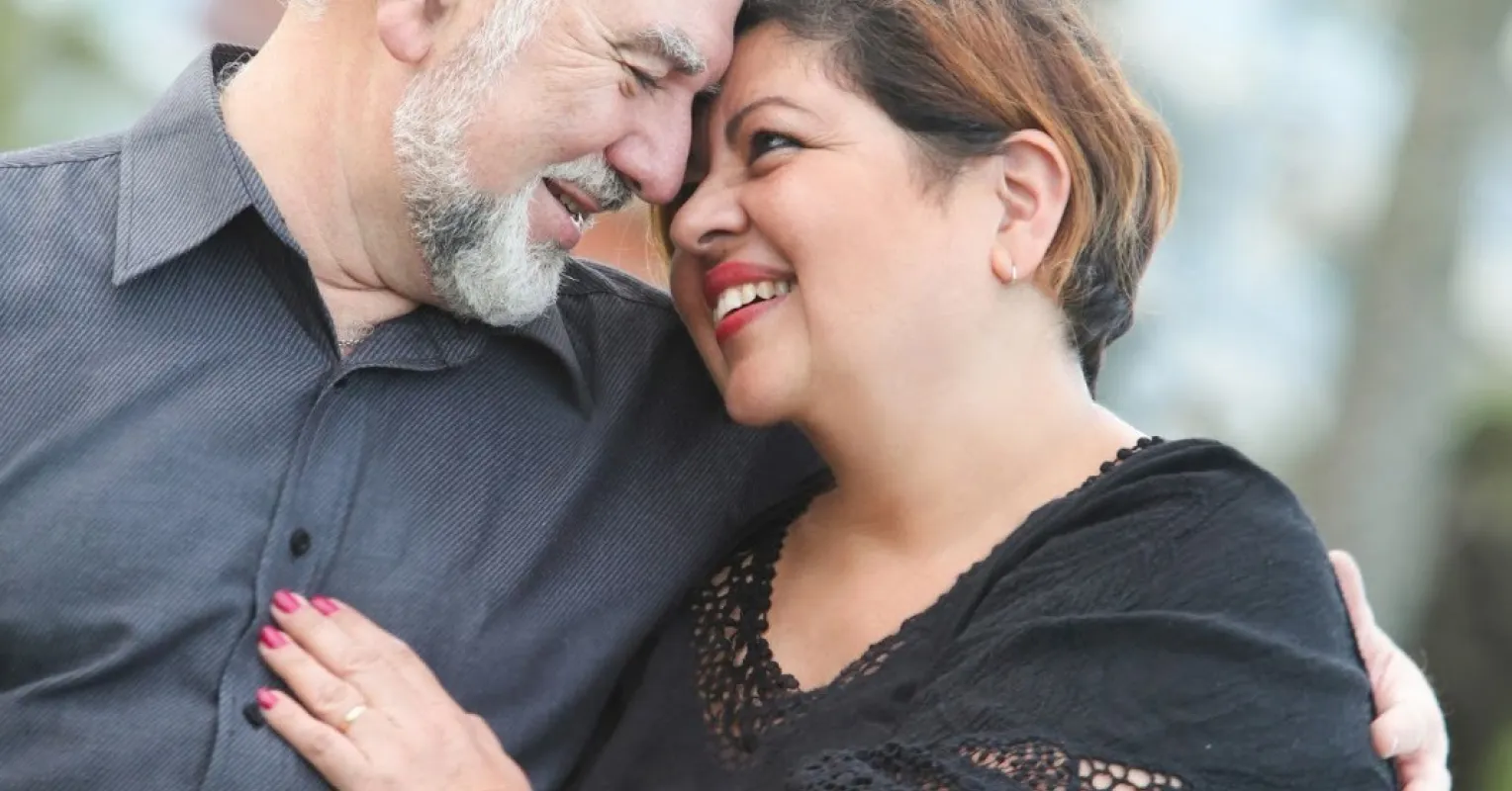 Couple sitting apart, reflecting on feelings of lost emotional connection