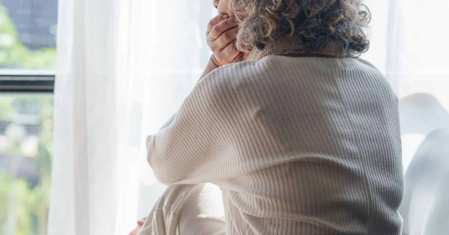 Individual contemplating feelings of shame after estranging a toxic family member