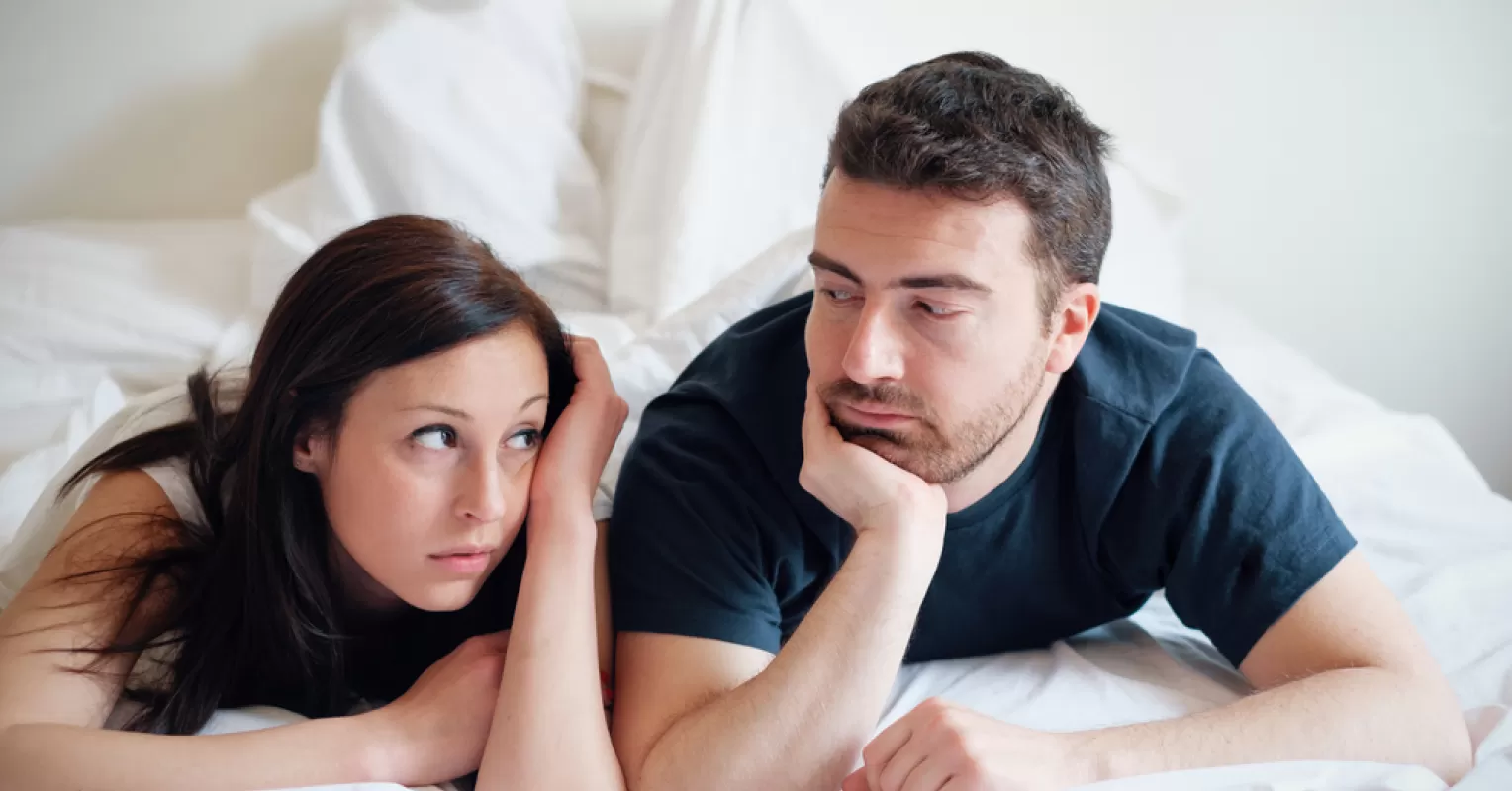 Couple reflecting on their marriage decision, pondering feelings of regret over time