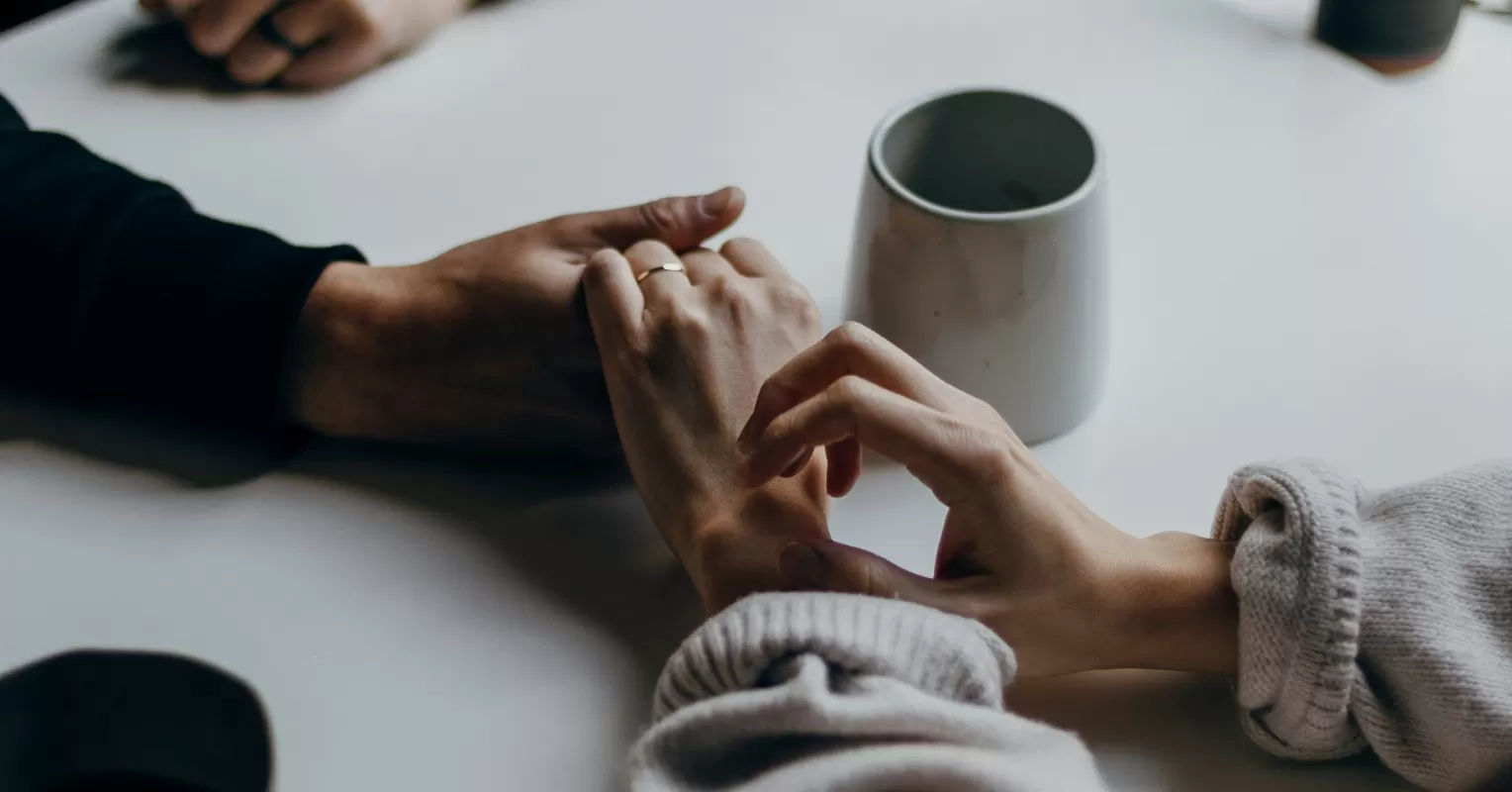 Individual reflecting on feelings of inadequacy triggered by their partner's success