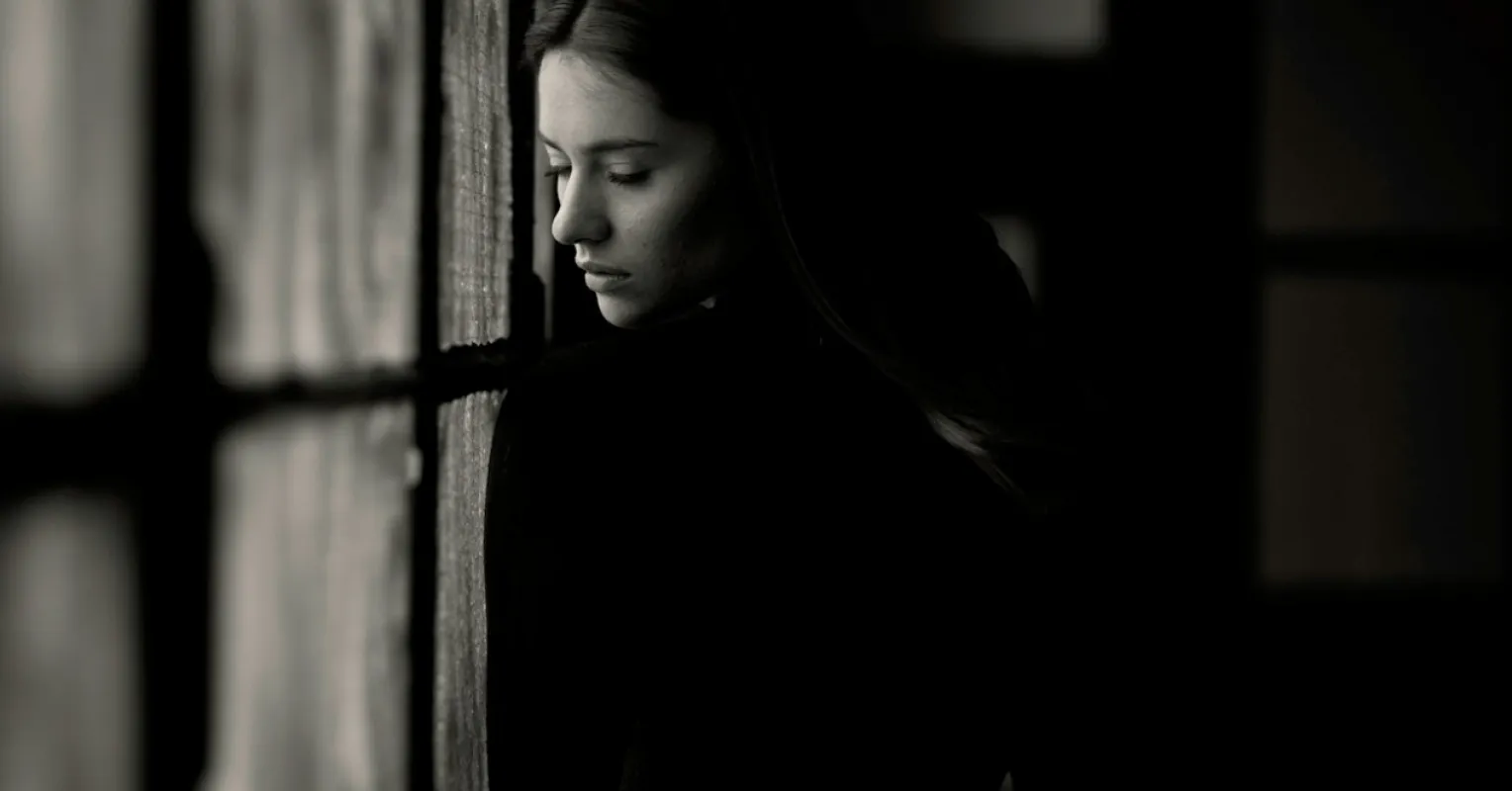 Person scrolling through social media, reflecting on feelings of loneliness and connection