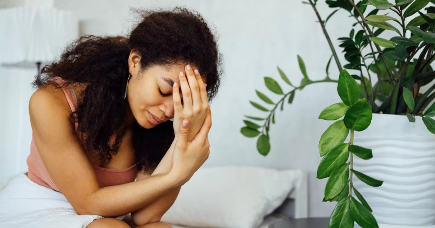 Person deep in thought about dreams of an ex and unresolved feelings