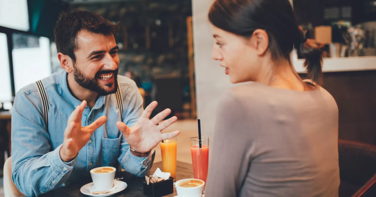 Couple engaged in a calm conversation while navigating difficult relationship signals