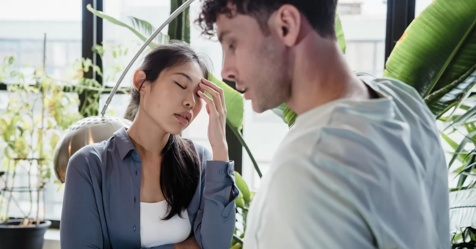 Couple calmly discussing their feelings during a heated argument to avoid escalation