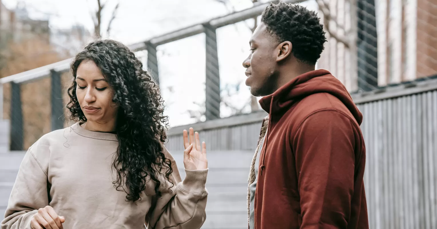 Couple sitting together, sharing feelings without causing emotional invalidation