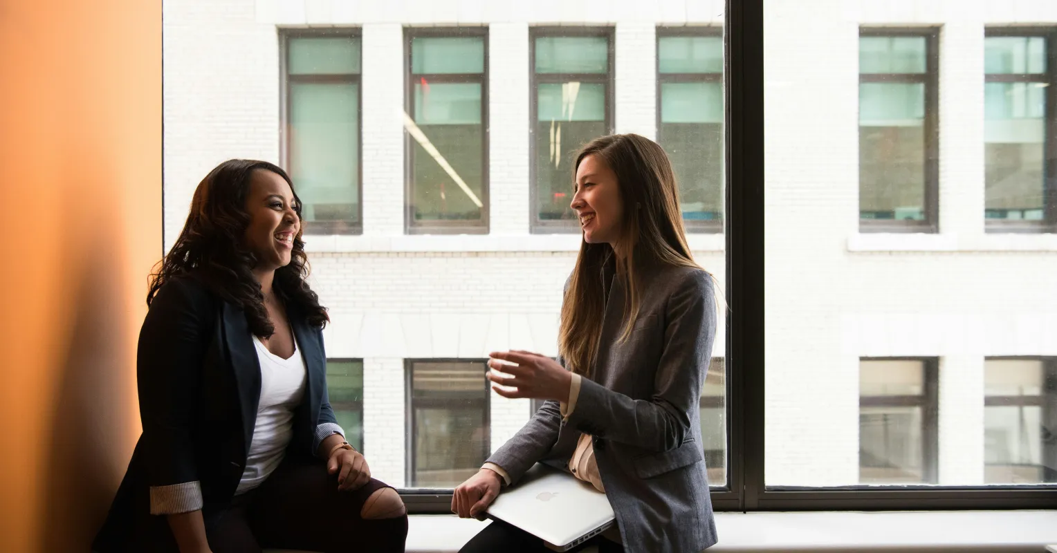 Employee interpreting passive-aggressive signals from their boss during a tense meeting