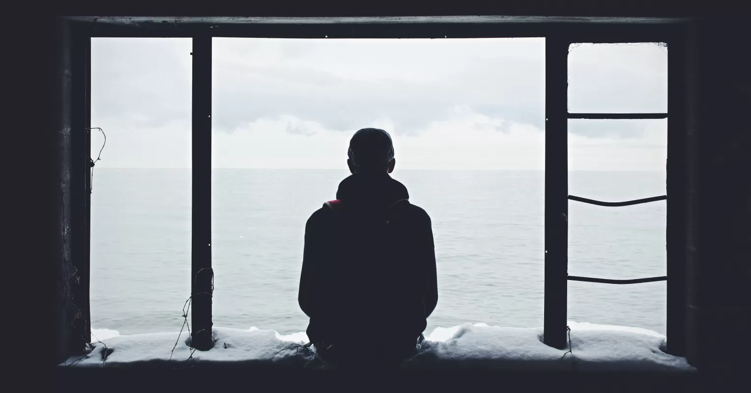Individual experiencing emotional turmoil while contemplating how to deal with anxiety after a breakup