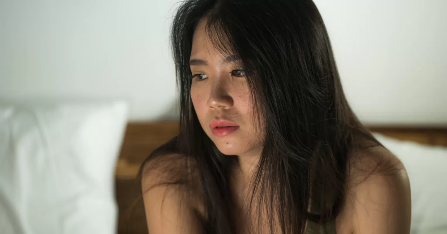 Individual contemplating self-worth and feelings of inadequacy in a relationship setting