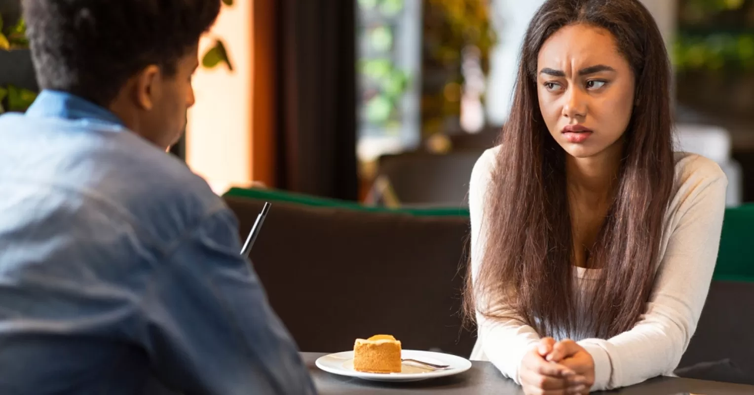 Person contemplating vague answers, reflecting trust issues in a close relationship