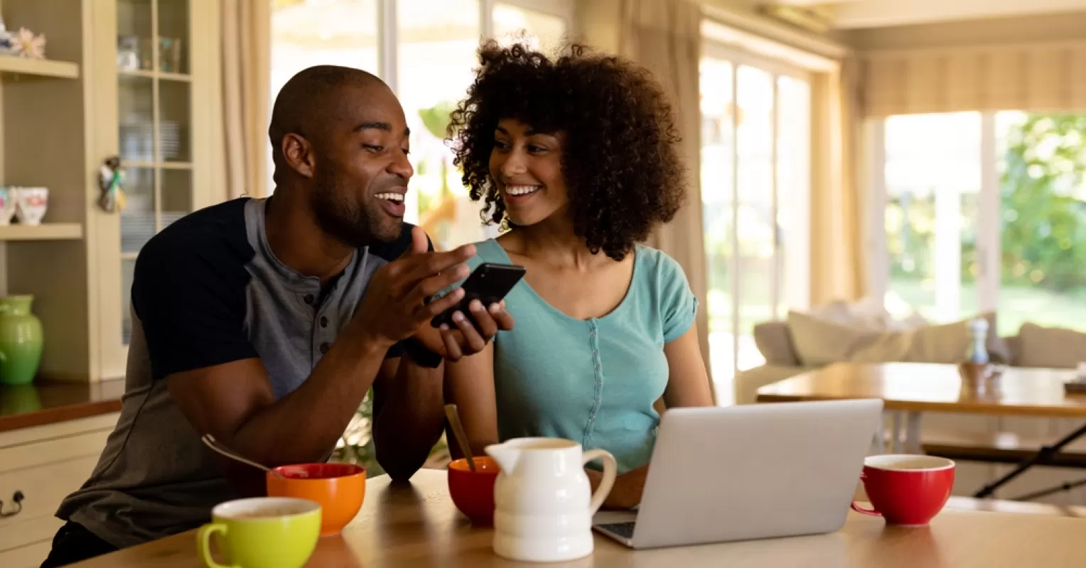 Couple sitting in silence after an argument, reflecting on emotional signals