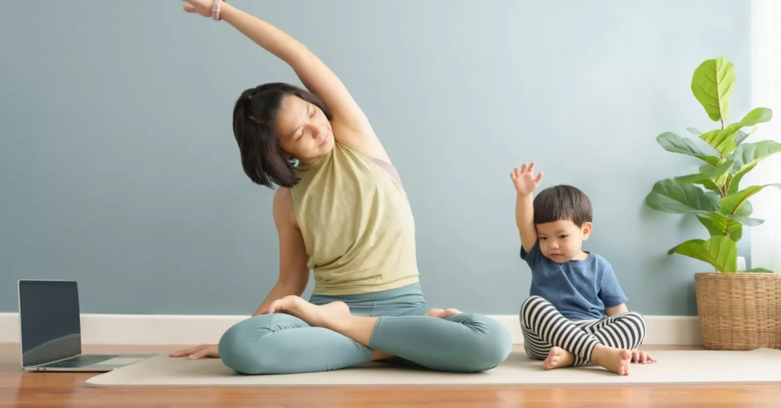 Parent engaging in hobbies while children play, modeling a fulfilling life