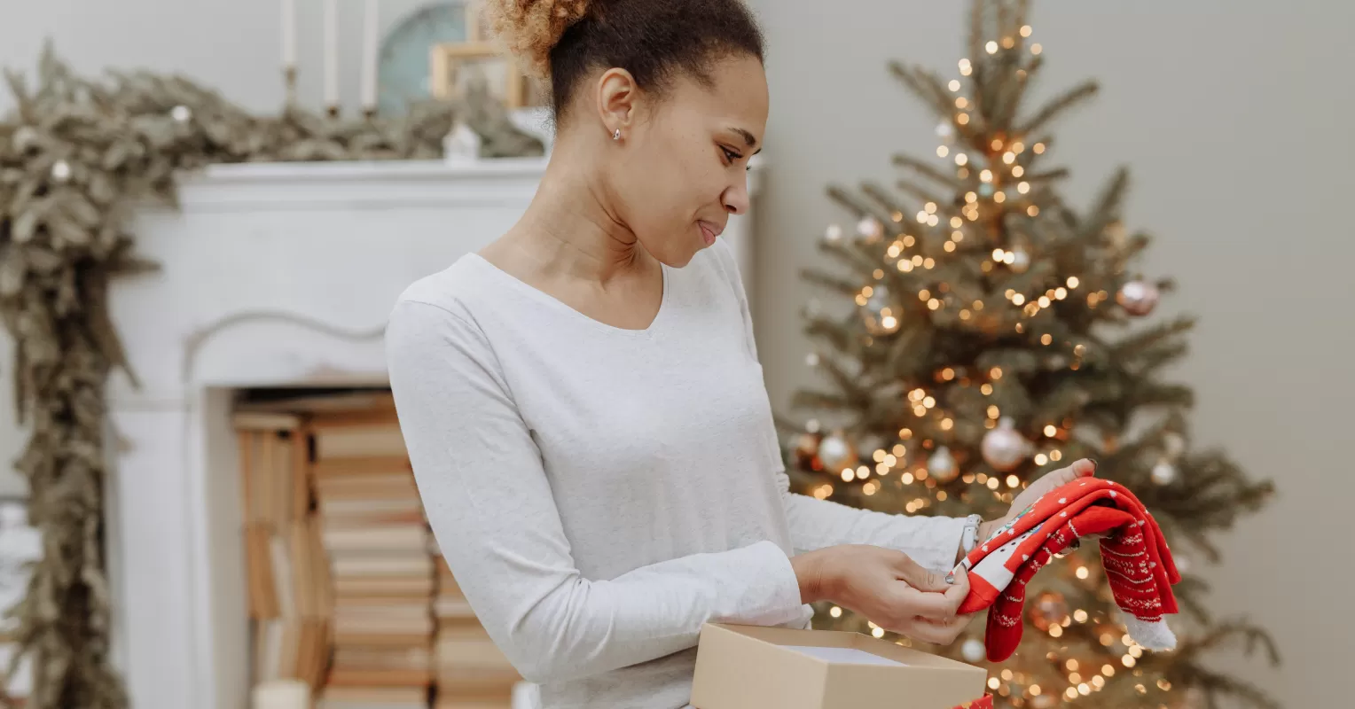 Individual feeling awkward while receiving an unexpected gift, illustrating gift reception discomfort