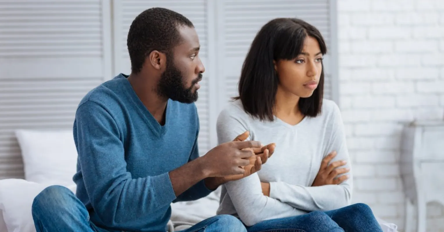 Partner taking deep breaths before a difficult conversation in a relationship