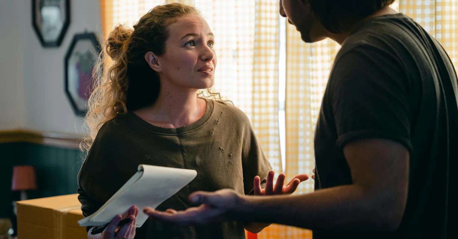 Couple having a heartfelt conversation about rebuilding trust after controlling behaviors.
