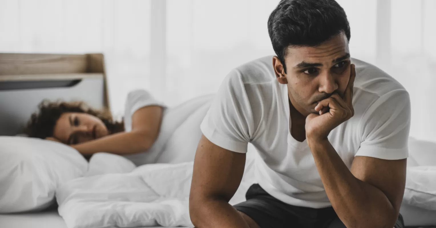 Person reflecting on uncertainty in a relationship connected to how to recognize if relationship arguments are a red