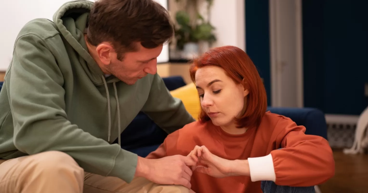 Individual feeling frustrated while trying to communicate with someone unresponsive in a relationship