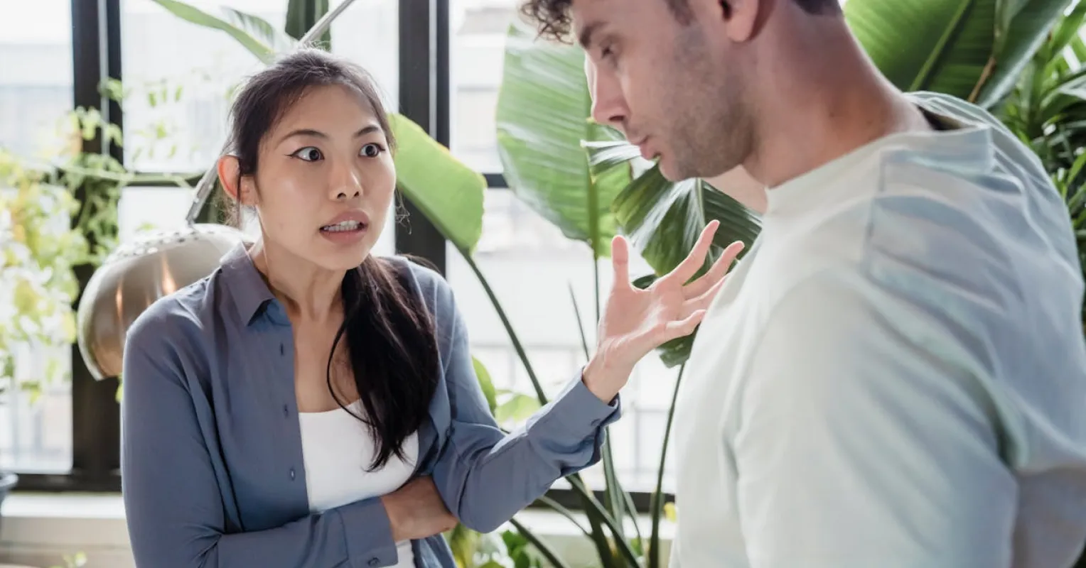 Person contemplating controlling behavior signs in a troubled relationship