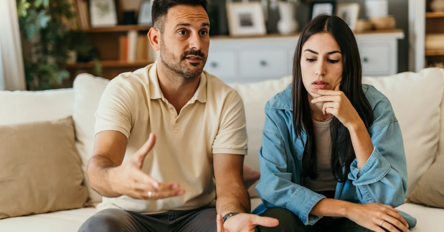 Couple discussing emotional boundaries while maintaining respectful eye contact