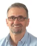 A couple sitting apart, showing emotional disconnection during relationship difficulties and empathy challenges