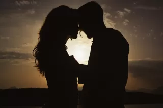 Person contemplating mixed feelings about a romantic relationship, reflecting on emotional signals.