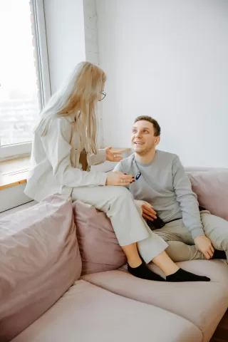 Person struggling with the urge to express feelings during a relationship conversation