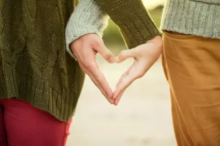 A comforting hug exchanged between friends during a moment of grief and emotional support
