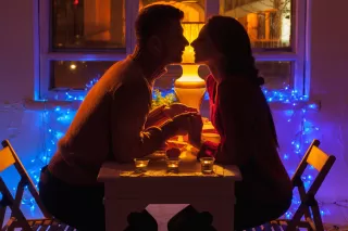 Couple sitting apart, reflecting on why romantic relationships sometimes lack true emotional connection