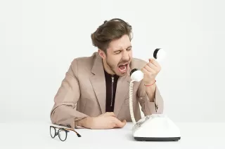 Individual expressing frustration after being interrupted during an important conversation