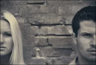 Couple discussing their differing political views in a calm and understanding manner