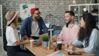 Individual contemplating feelings of guilt about not bonding with colleagues in a work setting