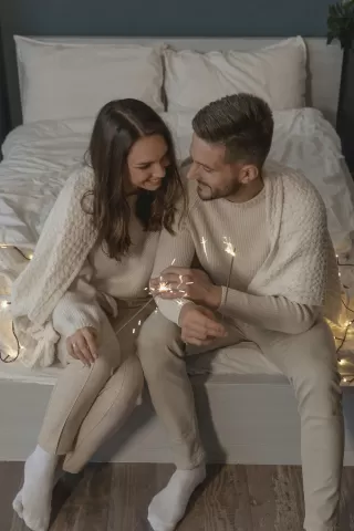 Couple sitting in silence, indicating avoidance of deep conversations in their relationship